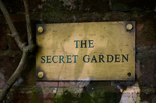 Brass sign at entrance to the Secret Garden, Groombridge Place, England